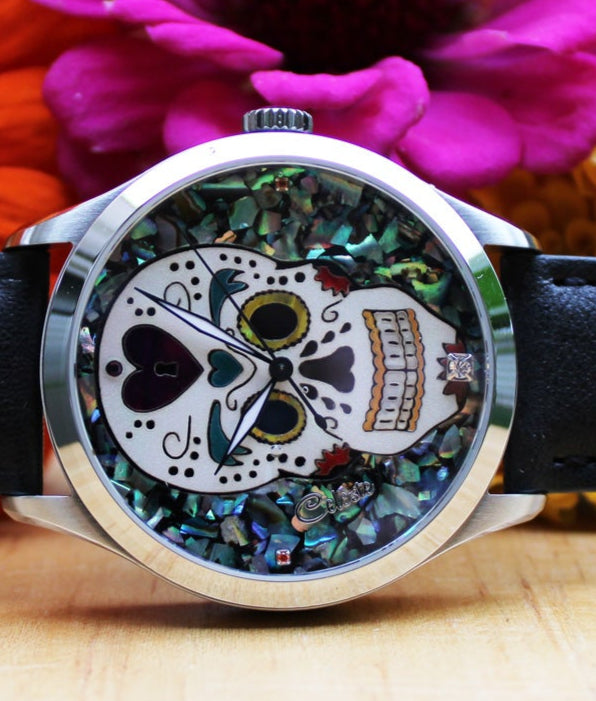 Handcrafted Sugar Skull watch made with abalone shell and mother of pearl.